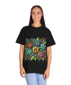 Colorful floral t-shirt with artistic flower print, vibrant unisex garment-dyed tee, bohemian botanical design t-shirt, handmade style floral print tee on light blue fabric.