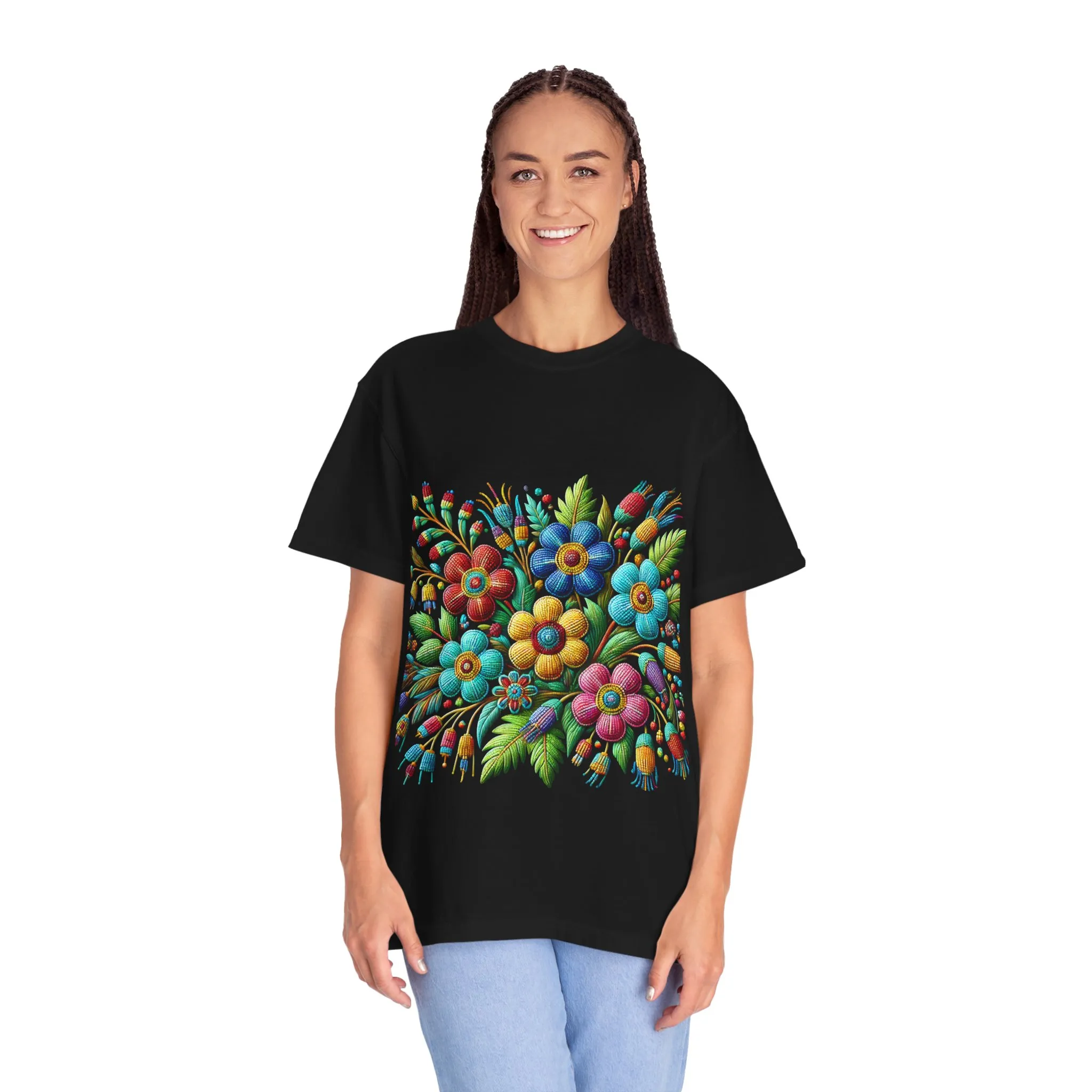 Colorful floral t-shirt with artistic flower print, vibrant unisex garment-dyed tee, bohemian botanical design t-shirt, handmade style floral print tee on light blue fabric.