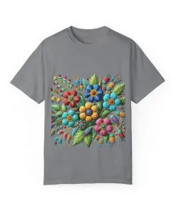 Colorful floral t-shirt with artistic flower print, vibrant unisex garment-dyed tee, bohemian botanical design t-shirt, handmade style floral print tee on light blue fabric.