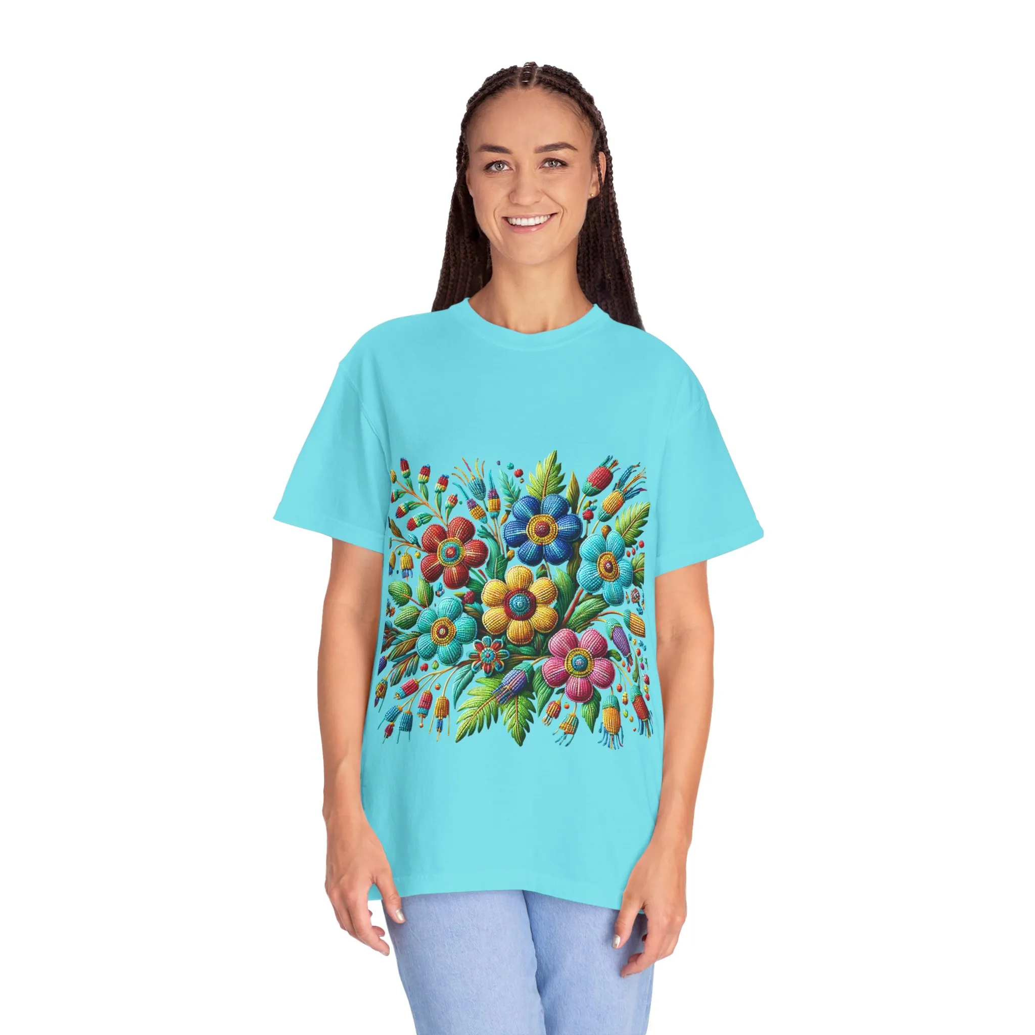 Colorful floral t-shirt with artistic flower print, vibrant unisex garment-dyed tee, bohemian botanical design t-shirt, handmade style floral print tee on light blue fabric.