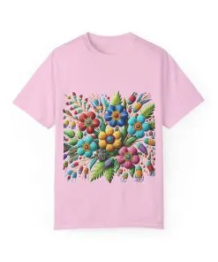 Colorful floral t-shirt with artistic flower print, vibrant unisex garment-dyed tee, bohemian botanical design t-shirt, handmade style floral print tee on light blue fabric.