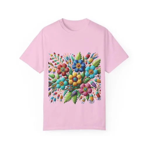 Colorful floral t-shirt with artistic flower print, vibrant unisex garment-dyed tee, bohemian botanical design t-shirt, handmade style floral print tee on light blue fabric.