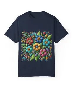 Colorful floral t-shirt with artistic flower print, vibrant unisex garment-dyed tee, bohemian botanical design t-shirt, handmade style floral print tee on light blue fabric.