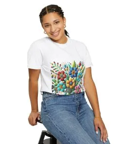 Colorful floral t-shirt with artistic flower print, vibrant unisex garment-dyed tee, bohemian botanical design t-shirt, handmade style floral print tee on light blue fabric.