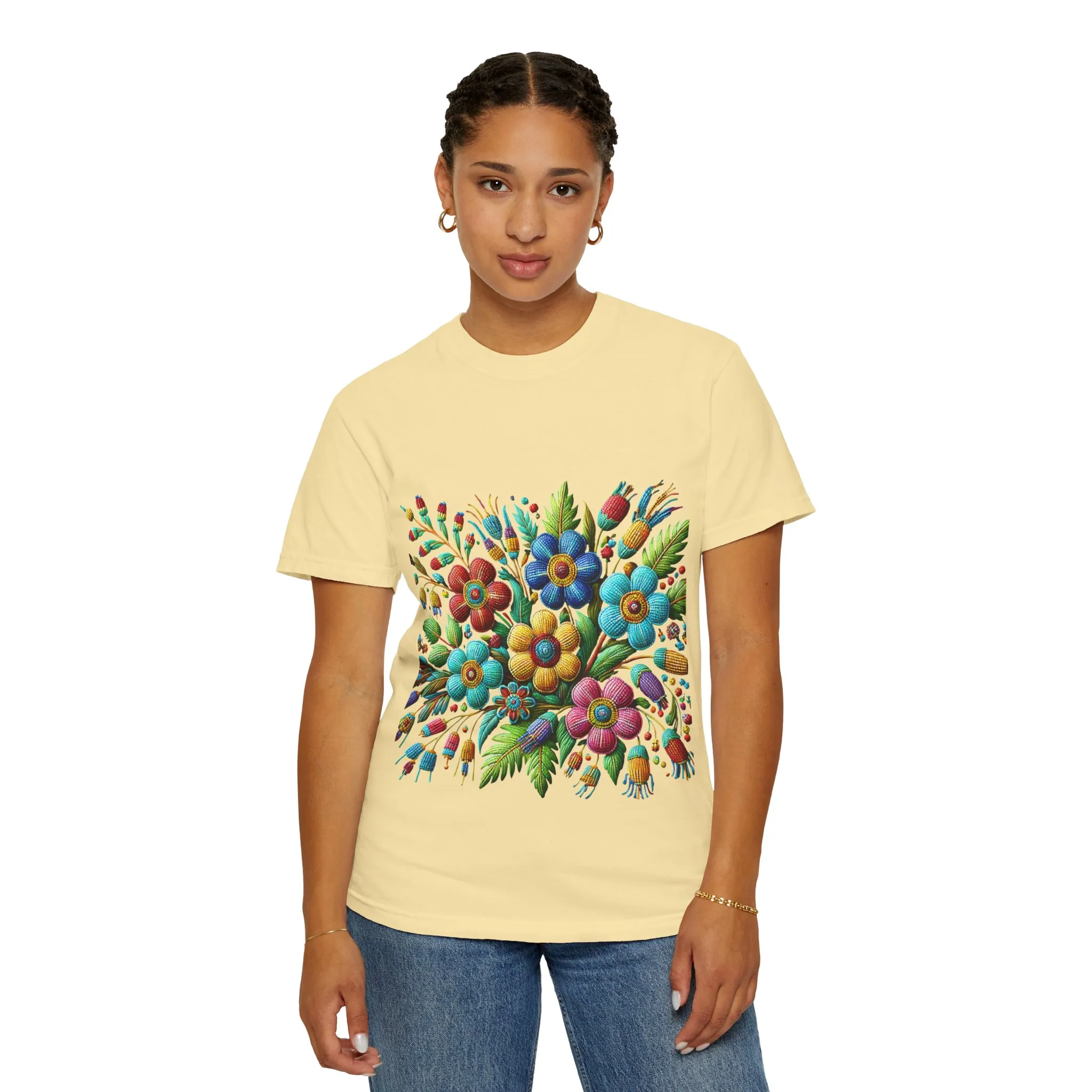 Colorful floral t-shirt with artistic flower print, vibrant unisex garment-dyed tee, bohemian botanical design t-shirt, handmade style floral print tee on light blue fabric.