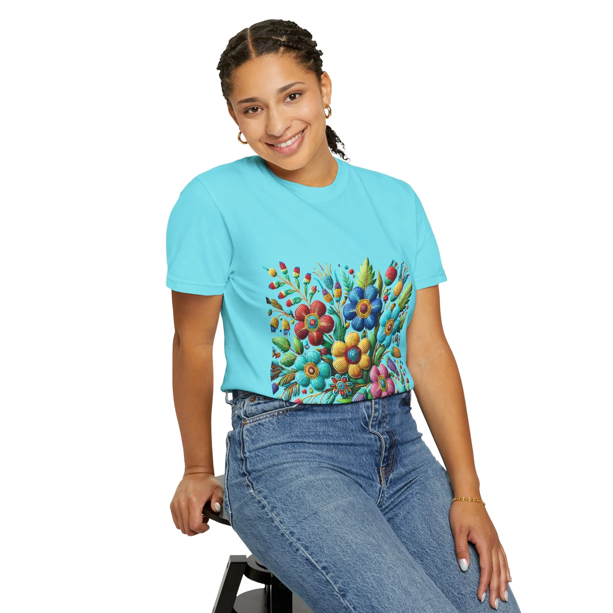 Colorful floral t-shirt with artistic flower print, vibrant unisex garment-dyed tee, bohemian botanical design t-shirt, handmade style floral print tee on light blue fabric.