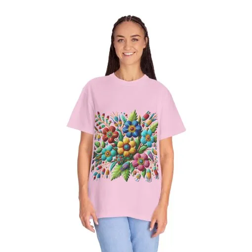 Colorful floral t-shirt with artistic flower print, vibrant unisex garment-dyed tee, bohemian botanical design t-shirt, handmade style floral print tee on light blue fabric.