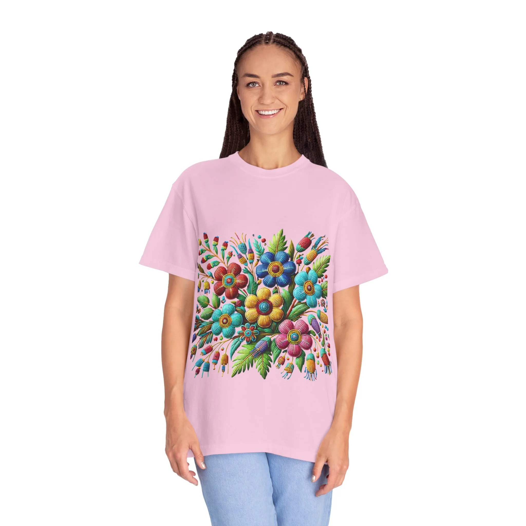 Colorful floral t-shirt with artistic flower print, vibrant unisex garment-dyed tee, bohemian botanical design t-shirt, handmade style floral print tee on light blue fabric.