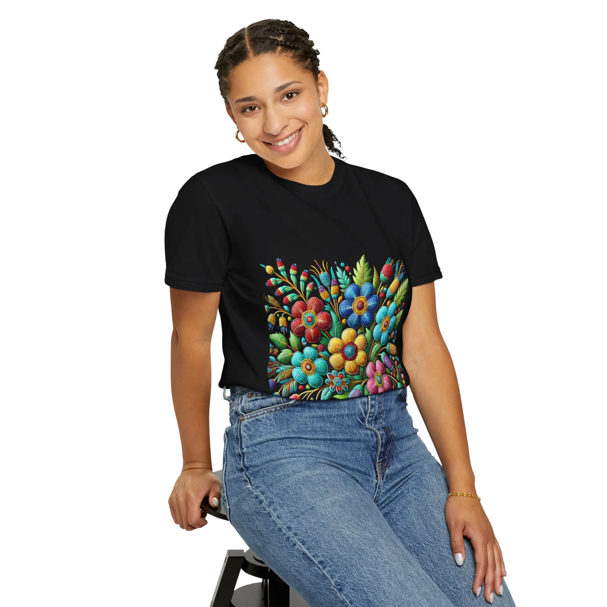 Colorful floral t-shirt with artistic flower print, vibrant unisex garment-dyed tee, bohemian botanical design t-shirt, handmade style floral print tee on light blue fabric.
