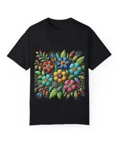 Colorful floral t-shirt with artistic flower print, vibrant unisex garment-dyed tee, bohemian botanical design t-shirt, handmade style floral print tee on light blue fabric.