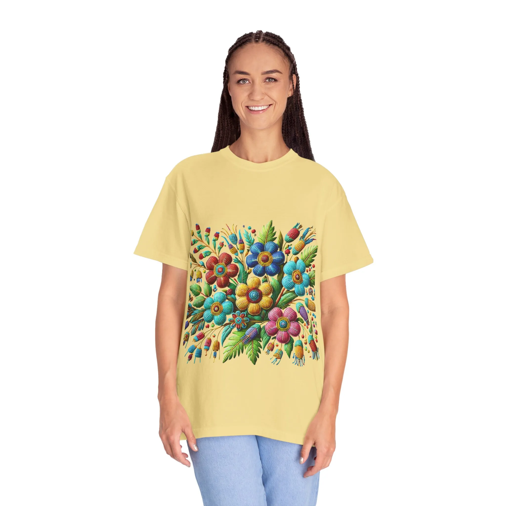 Colorful floral t-shirt with artistic flower print, vibrant unisex garment-dyed tee, bohemian botanical design t-shirt, handmade style floral print tee on light blue fabric.