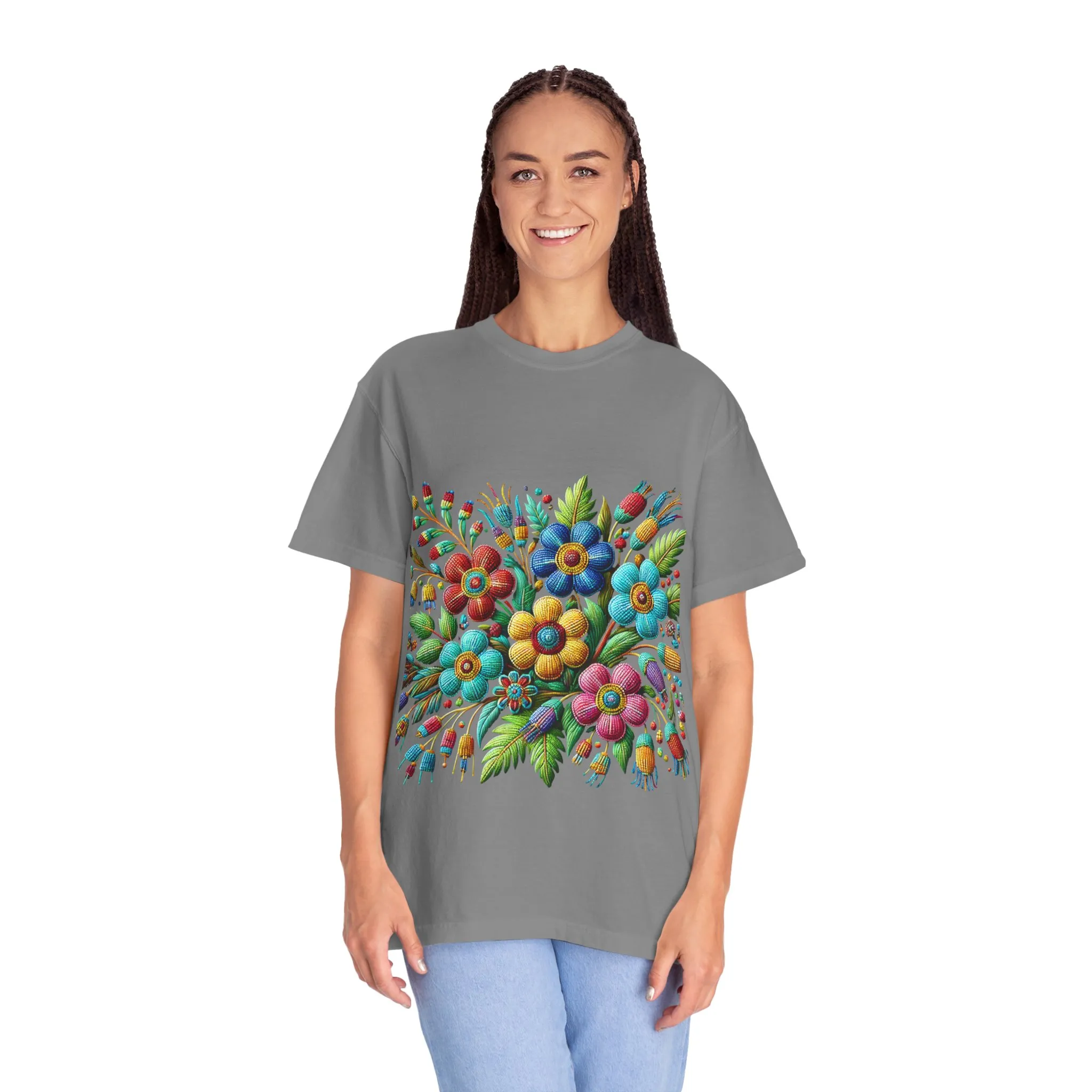 Colorful floral t-shirt with artistic flower print, vibrant unisex garment-dyed tee, bohemian botanical design t-shirt, handmade style floral print tee on light blue fabric.