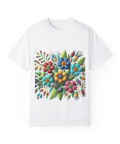 Colorful floral t-shirt with artistic flower print, vibrant unisex garment-dyed tee, bohemian botanical design t-shirt, handmade style floral print tee on light blue fabric.