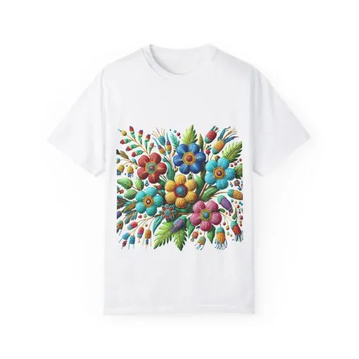 Colorful floral t-shirt with artistic flower print, vibrant unisex garment-dyed tee, bohemian botanical design t-shirt, handmade style floral print tee on light blue fabric.